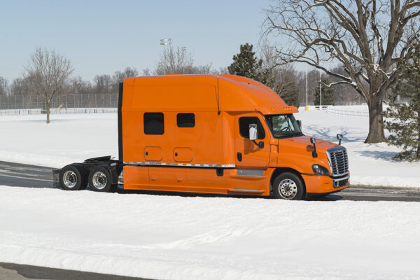 Bolt_150_inch_Platinum_Series_sleeper_orange_truck_full_view2