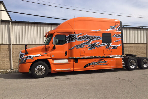 Bolt_150_inch_Platinum_Series_sleeper_orange_truck_w_decals_drivers_side