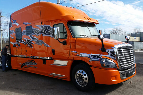 Bolt_150_inch_Platinum_Series_sleeper_orange_truck_w_decals_passenger_side